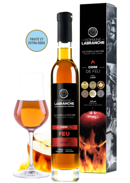 375 ml bottle of Quebec fire cider from Domaine Labranche with the packing box and a glass