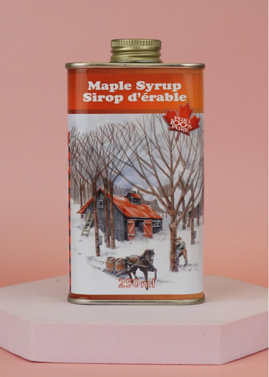 Three sizes of metal cans with maple syrup Three sizes of metal cans with maple syrup
